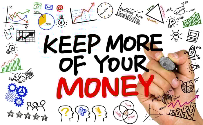 We see a hand that has written keep more of your money on a clear board, surrounded by doodles of graphs and lightbulbs, suggesting great ideas and growth.