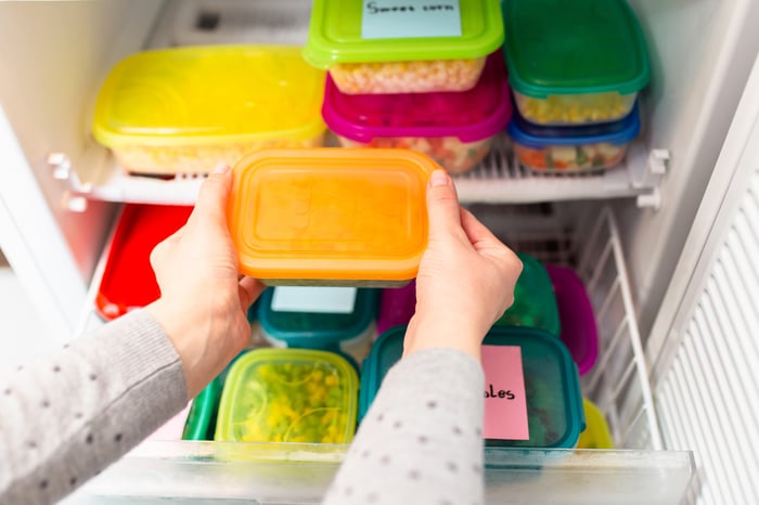 A pantry full of food storage containers.