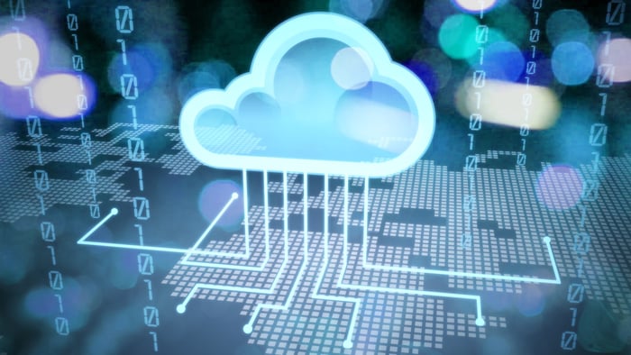 A digital circuit board with a cloud over it