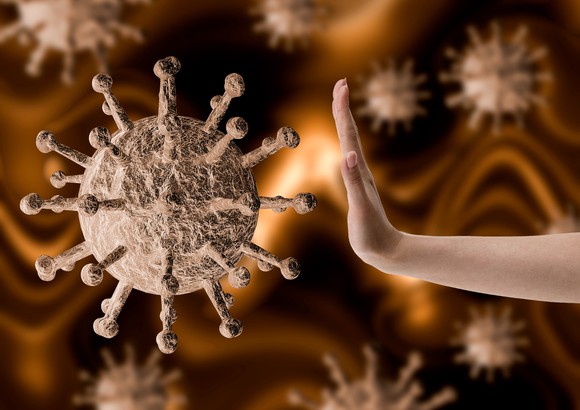 A woman's hand appearing to resist the coronavirus.