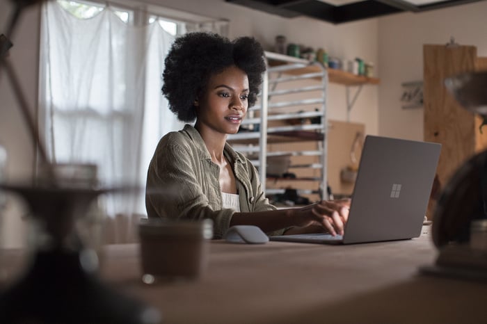 Woman using Surface Laptop