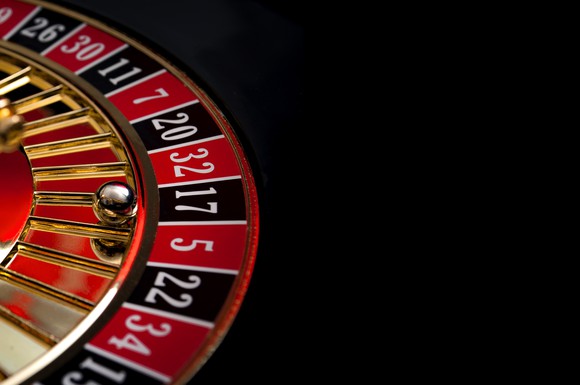 Roulette wheel with a black background.