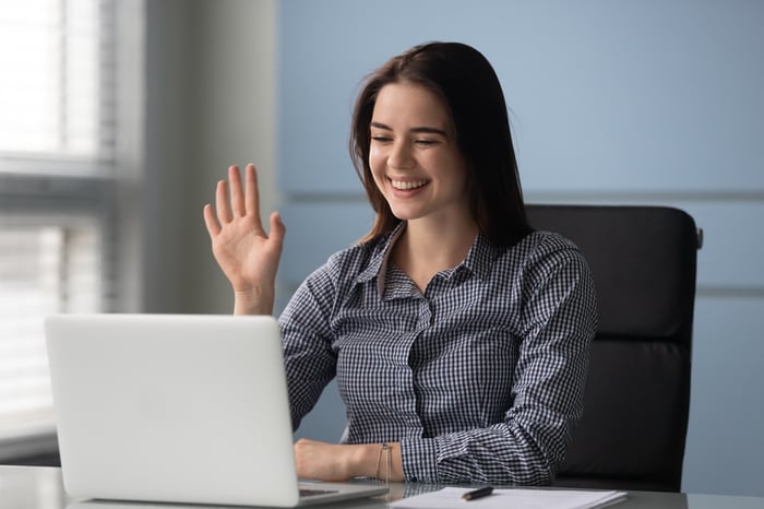 Woman happily working remotely. 