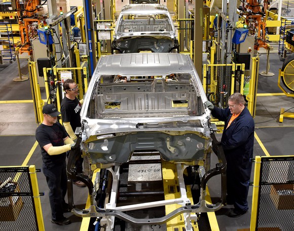 Workers tend to partially assembled pickups at Ford's Kentucky Truck Plant in Louisville, KY.