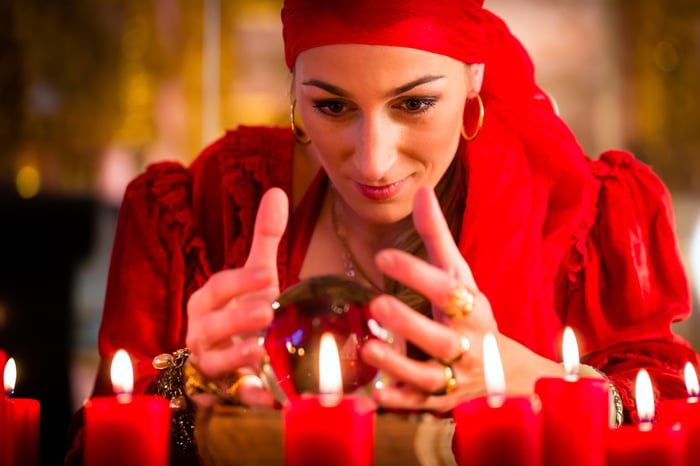 fortune teller gazing into a crystal ball