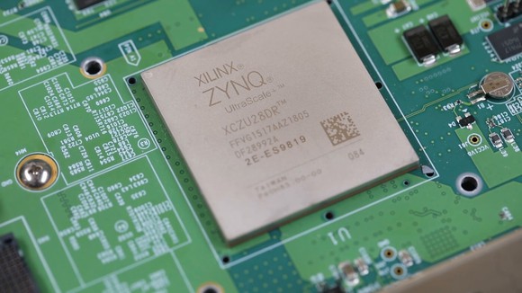 A close-up picture of a Xilinx FPGA chip.