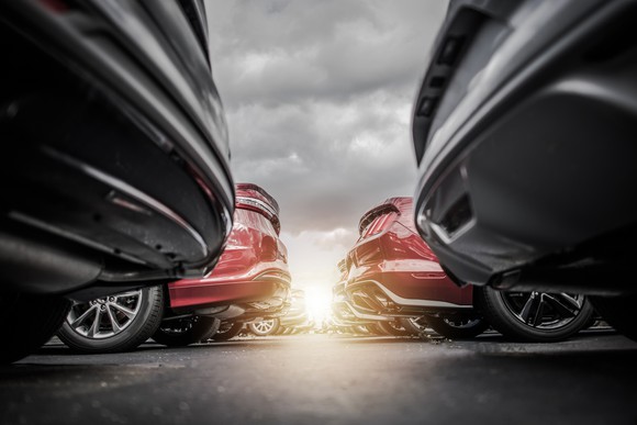 Rows of vehicles at a new-car dealership.