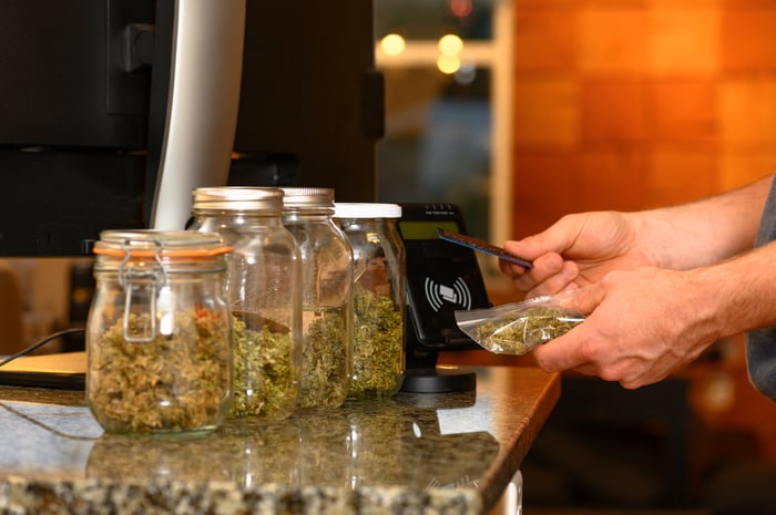 A person buys cannabis at a dispensary with a credit card