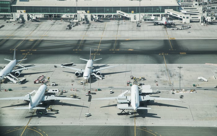 Airplanes parked at an airport.