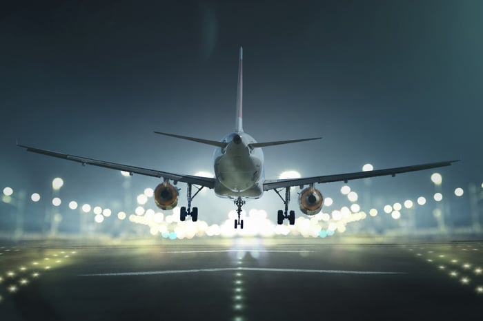 An airplane landing at night.