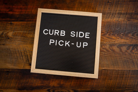 A curbside pickup sign.
