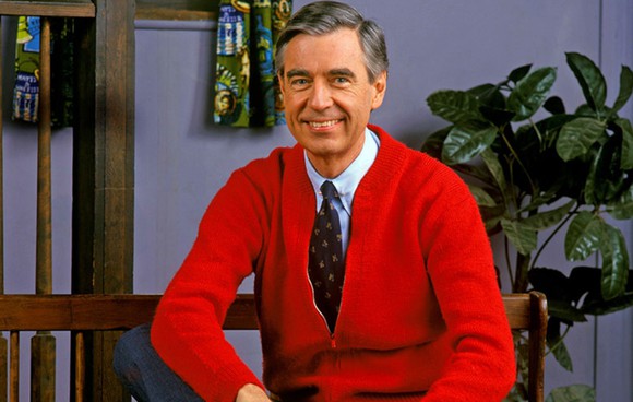 Mr. Rogers in his trademark red cardigan sweater