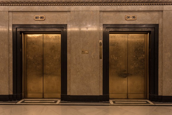 The doors of two high-end elevators.