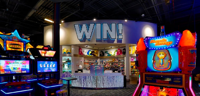 Dave & Buster's restaurant interior showing brightly lit gaming machines. 