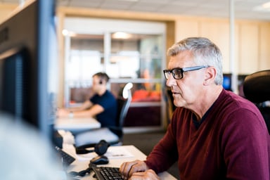 Older man at computer typing on keyboard_GettyImages-915946324