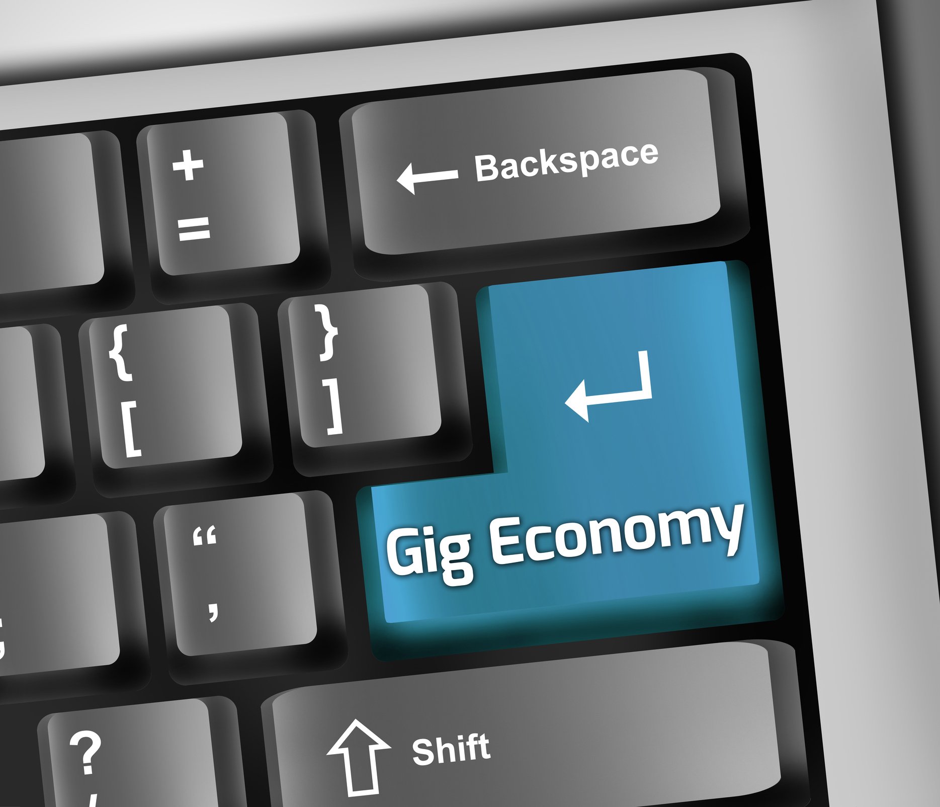 A computer keyboard with a button labeled gig economy.