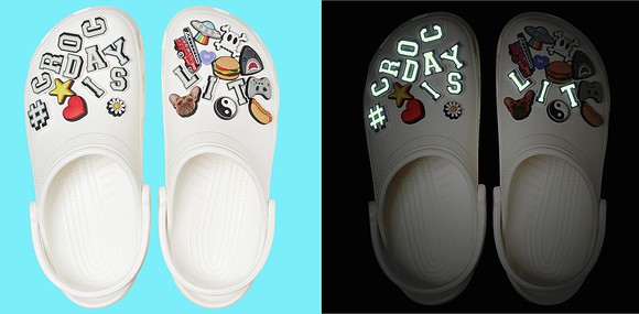 A view from above of Crocs that glow in the dark as part of a promotional event.