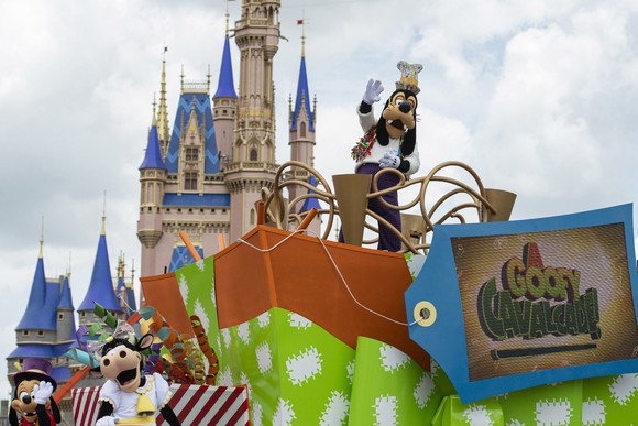 Goofy waves from a float in the Magic Kingdom.