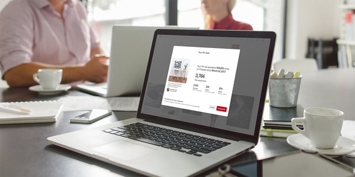 A Pinterest website page open on a laptop located on a dining table.