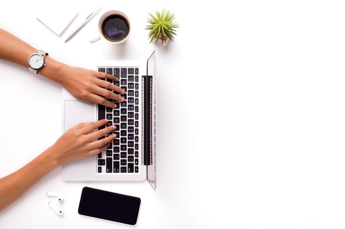 A person using a laptop.