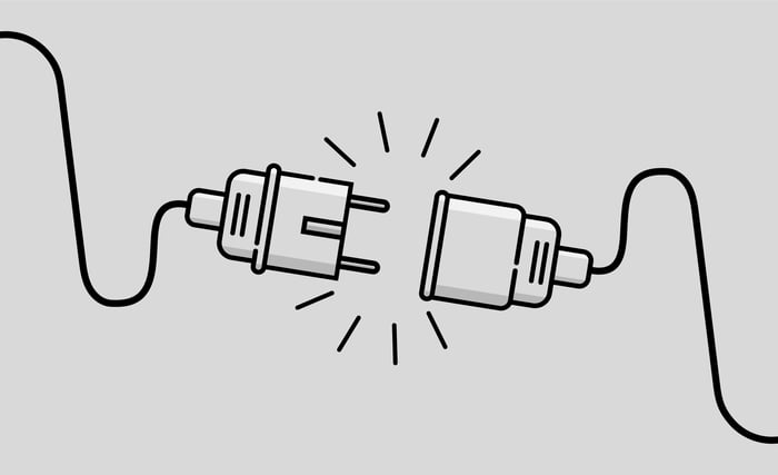 Black and white drawing of an electric plug and a connector