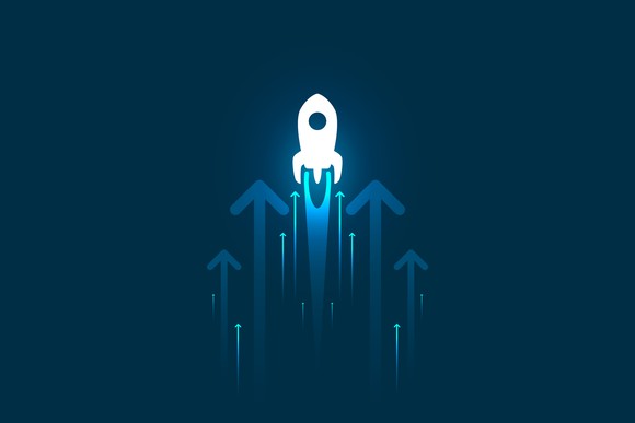 A small white rocket with arrows around it on a blue background.