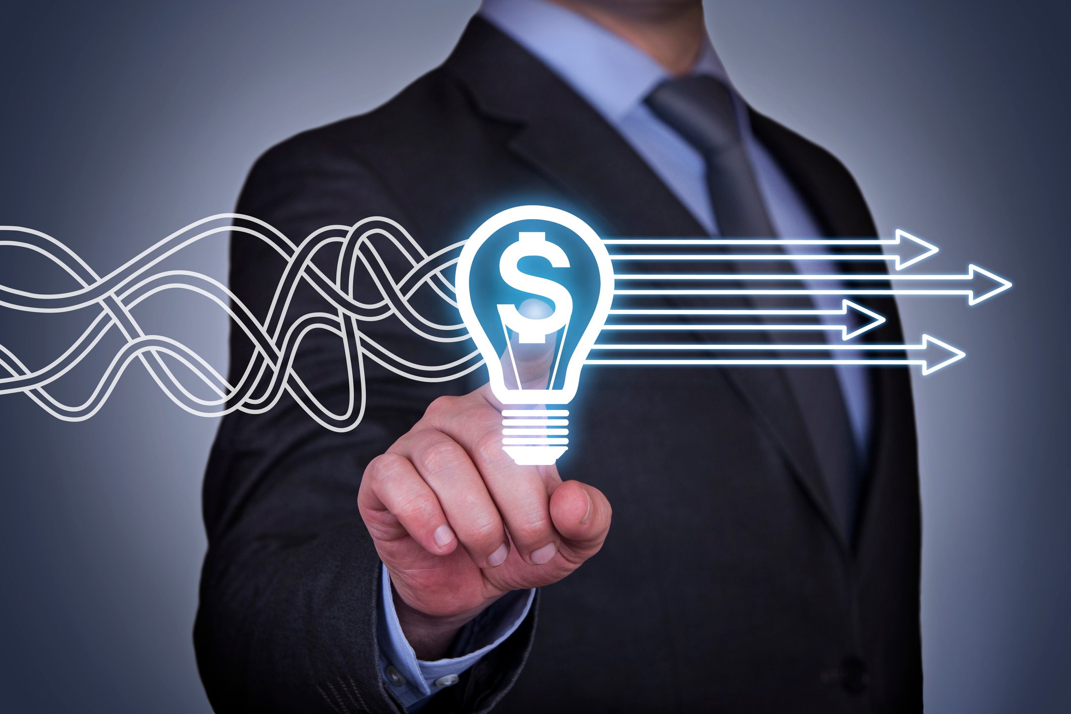 Businessman pointing to light bulb with dollar sign and arrows
