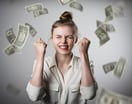 money raining on woman smiling and celebrating -- rich wealthy jackpot cash