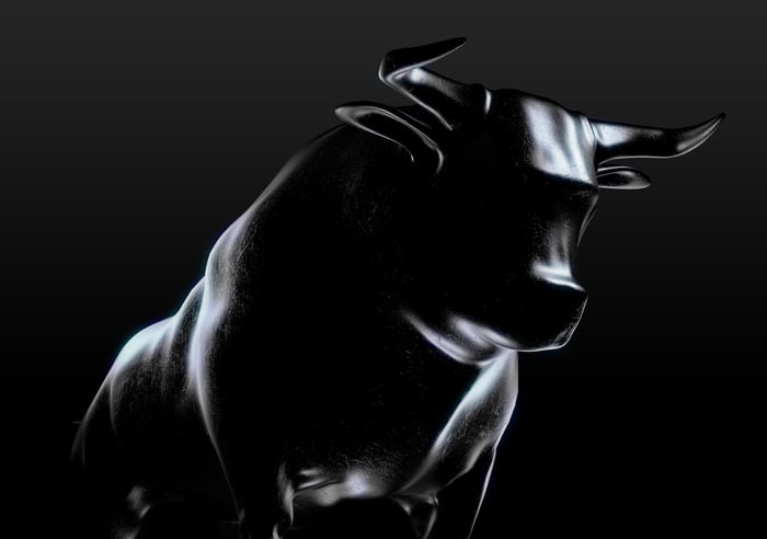 A shaded outline of a bull on a black background. 