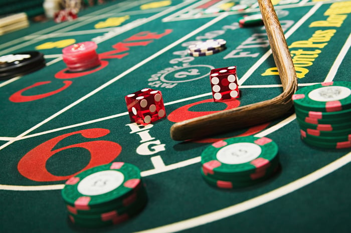 A gambling table with dice and chips on it