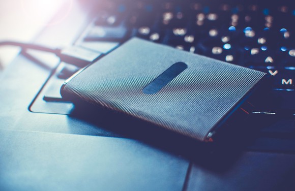 An external SSD connected to a laptop.