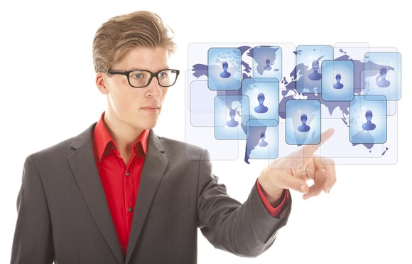 Male pointing at global people icons