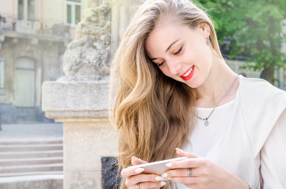 A woman using a smartphone.