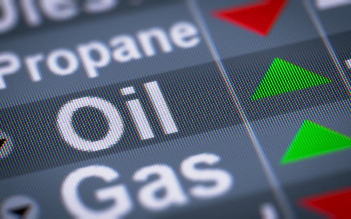 Green upward arrow on an oil commodity ticker board