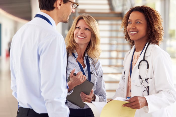 Physician speaking to a sales rep.