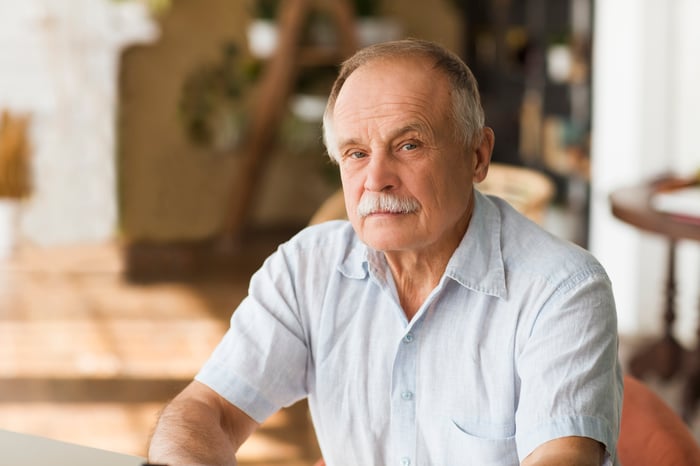 Older man with serious expression