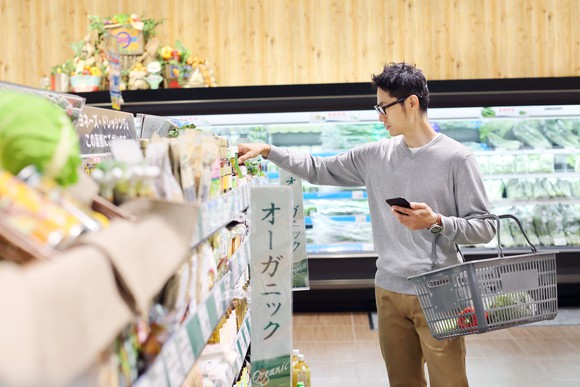 A man shopping in a Japanese supermarket.
