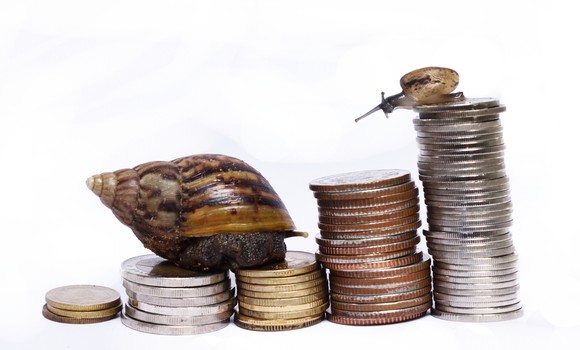 Two snails climbing several coin stacks of increasing height.
