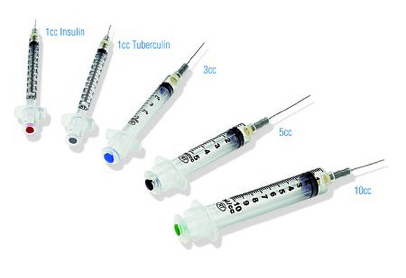 A display of five different syringes on a white background.