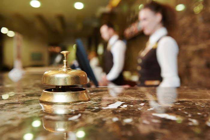 The front desk of a hotel lobby.