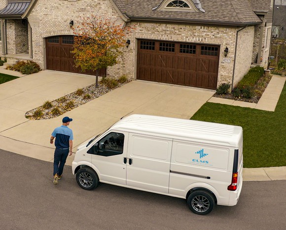 Electric Last Mile delivery van arriving at a home