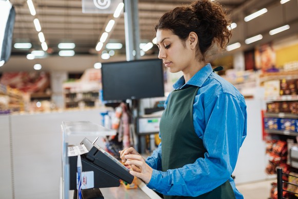 Female supermarket cashier