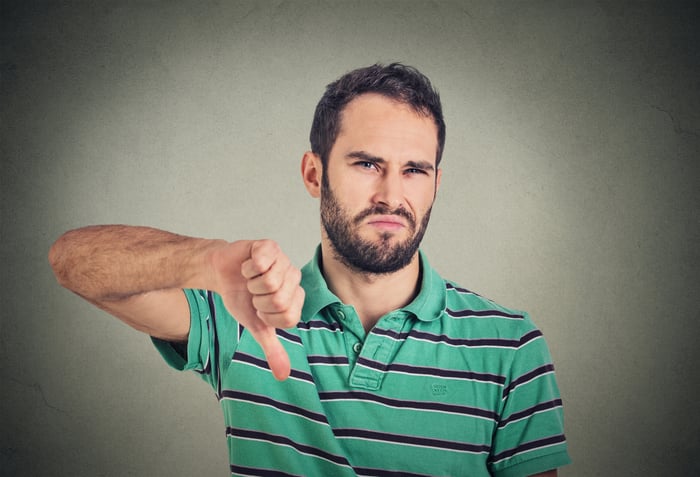 Man making a thumbs down sign