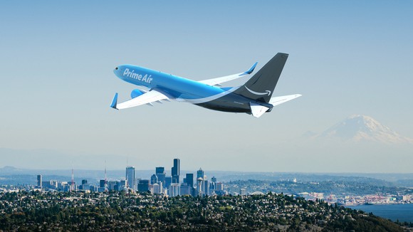 Amazon Prime Air plane flying above a city.