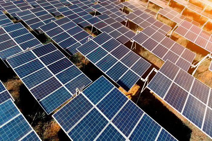 The sun beating down on a commercial solar farm.