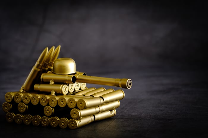 Bullets and cartridges piled up in the form of a tank.