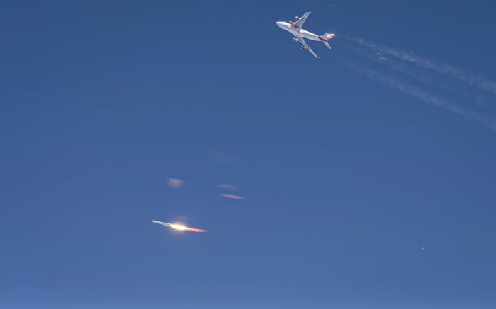 Cosmic Girl mothership veers off as the LauncherOne rocket blasts toward space.