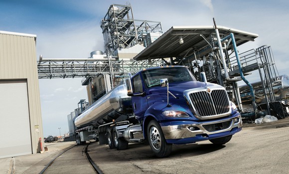 A blue International RH semi truck with a tanker trailer.