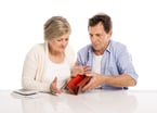 GettyImages-487422425 -- Senior couple worried about money