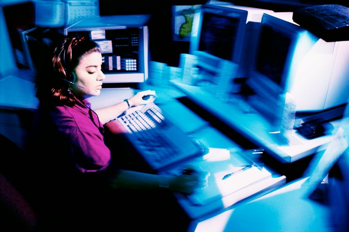 woman sitting a police dispatch center